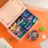 The Vedas Tea chest Premium Tea gift set | 48 handstitched cotton teabags | 12 flavours | 1 The Vedas Branded Mug with Infuser | 1 Sand clock specially designed for our teas | 1 Coaster