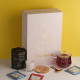 The Vedas Gift For MOM | 22 items | 8 Different Flavours teabags | 1 Luxury Oolong tea tin Caddy | total 56 Cups of tea | 1 Glass Mug for MOM With lid and Infuser | 1 Scented Candle | 1 Branded Spoon | 1 Wooden Coaster
